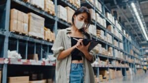 young-asian-businesswoman-manager-wearing-face-mask-warehouse-using-digital-tablet-checking-inventory (1)